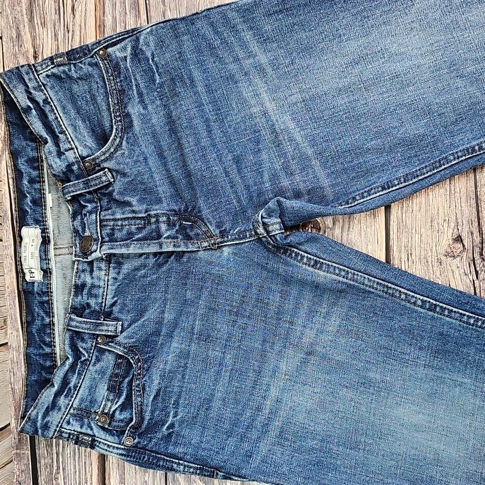 NEW FREE PEOPLE MID-RISE DISTRESSED RAW TIERED HEM FLARE LEG DENIM BLUE JEANS - Picture 2 of 12